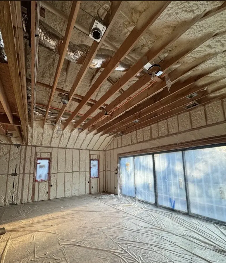 Interior walls and ceiling insulated with spray foam during new construction in Yosemite Lakes